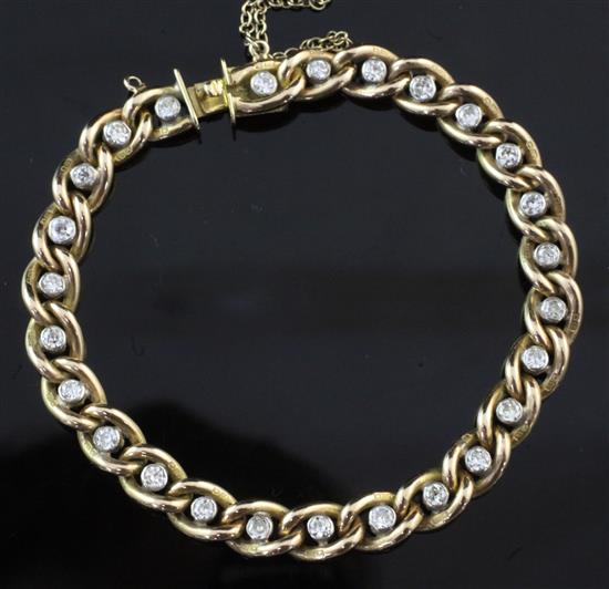 An 18ct gold and diamond curb link bracelet, 7.25in.
